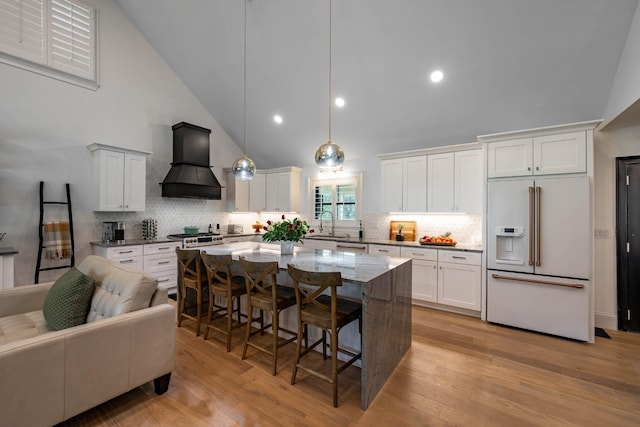2025 Sanford Dr, Mount Juliet, TN 37122 - kitchen with high vaulted ceiling, a kitchen bar, tasteful backsplash, custom range hood, and high end white refrigerator