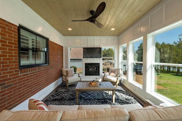 2025 Sanford Dr, Mount Juliet, TN 37122 - sunroom / solarium with an outdoor living space with a fireplace, wood ceiling, brick wall, and a wealth of natural light