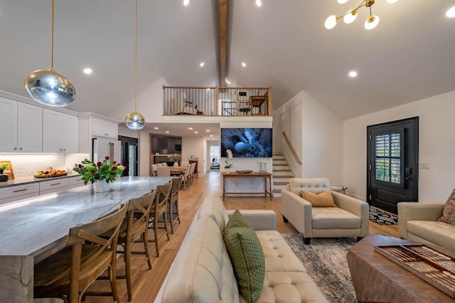 2025 Sanford Dr, Mount Juliet, TN 37122 - living room with beam ceiling, high vaulted ceiling, stairway, recessed lighting, and light wood-style flooring