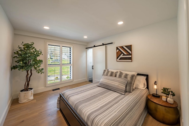 2025 Sanford Dr, Mount Juliet, TN 37122 - bedroom featuring baseboards, light wood-style flooring, recessed lighting, and a barn door