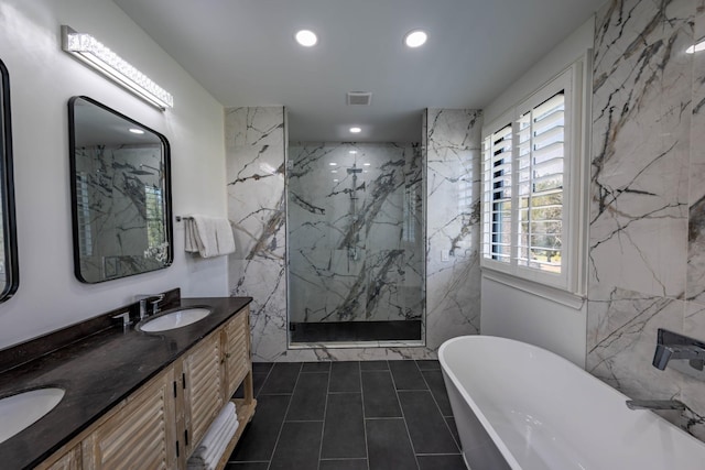 2025 Sanford Dr, Mount Juliet, TN 37122 - bathroom with double vanity, recessed lighting, a soaking tub, a sink, and a marble finish shower