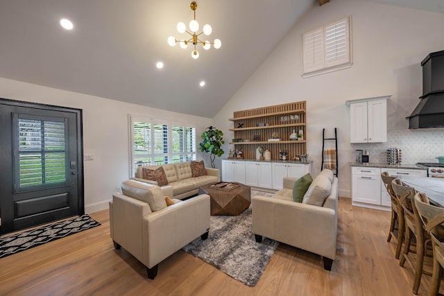 2025 Sanford Dr, Mount Juliet, TN 37122 - living room with an inviting chandelier, high vaulted ceiling, light wood-style floors, and a wealth of natural light