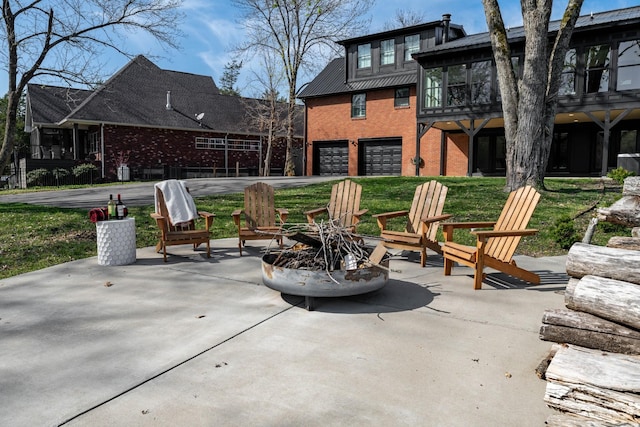 2025 Sanford Dr, Mount Juliet, TN 37122 - view of patio featuring an attached garage, a fire pit, and a sunroom