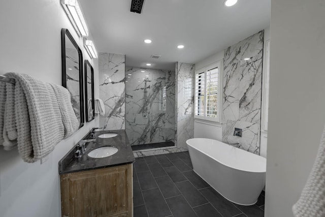 2025 Sanford Dr, Mount Juliet, TN 37122 - full bath featuring a freestanding bath, tile walls, a sink, a marble finish shower, and recessed lighting