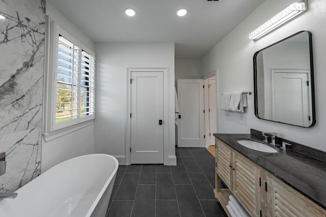 2025 Sanford Dr, Mount Juliet, TN 37122 - full bathroom featuring a freestanding tub, vanity, recessed lighting, and tile patterned floors