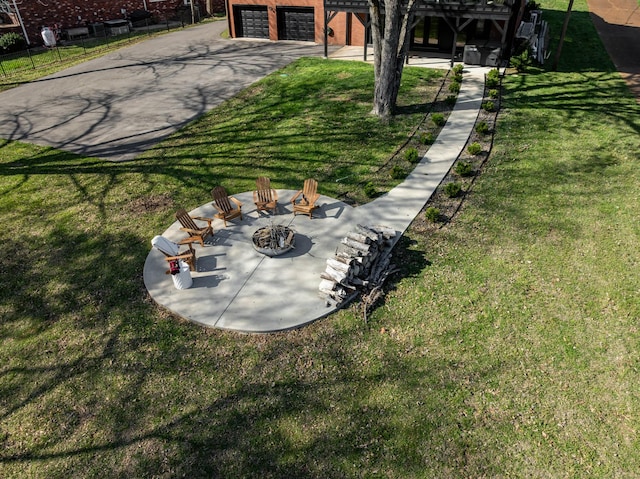 2025 Sanford Dr, Mount Juliet, TN 37122 - view of yard with a garage, a fire pit, fence, and driveway