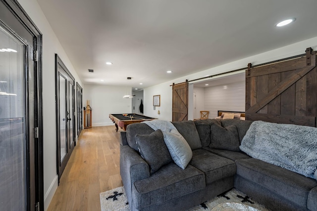 2025 Sanford Dr, Mount Juliet, TN 37122 - living room featuring light wood-type flooring, a barn door, and recessed lighting