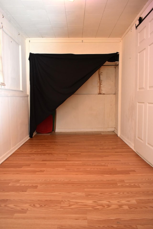 unfurnished bedroom featuring baseboards and light wood-style flooring