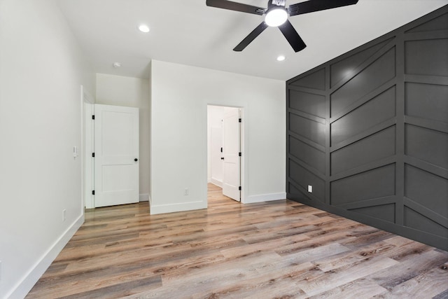 unfurnished bedroom featuring recessed lighting, baseboards, a ceiling fan, and light wood finished floors