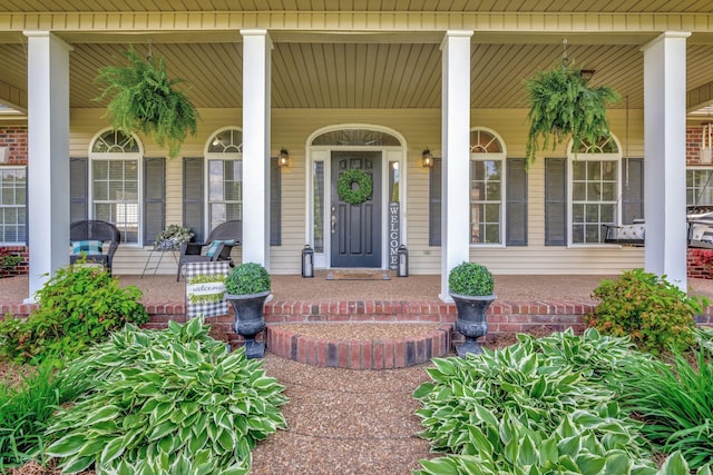 property entrance featuring covered porch