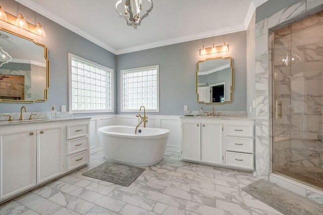 bathroom with an inviting chandelier, wainscoting, a sink, marble finish floor, and a stall shower