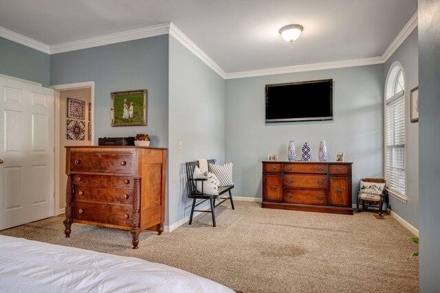 bedroom featuring crown molding, carpet flooring, and baseboards