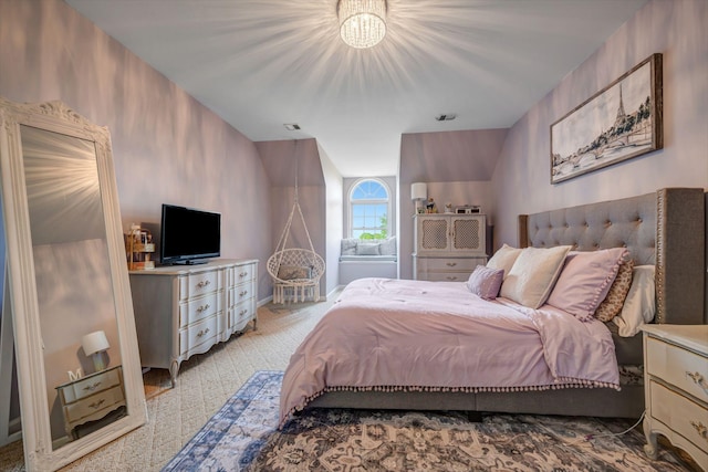bedroom featuring light carpet