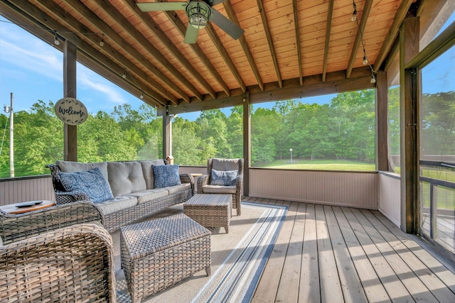 exterior space featuring an outdoor living space and ceiling fan