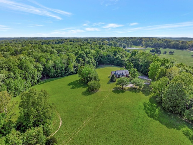 birds eye view of property featuring a wooded view