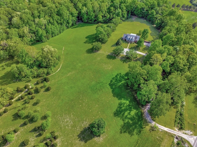birds eye view of property with a rural view