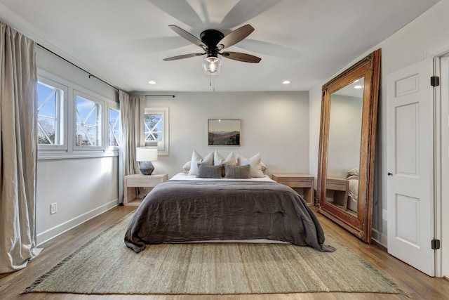 bedroom featuring recessed lighting, baseboards, a ceiling fan, and wood finished floors