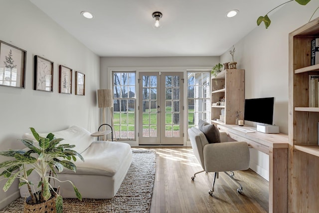 office with recessed lighting, french doors, and wood finished floors