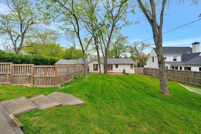 view of yard featuring a fenced backyard