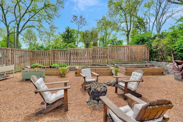 view of yard with a fenced backyard and a vegetable garden
