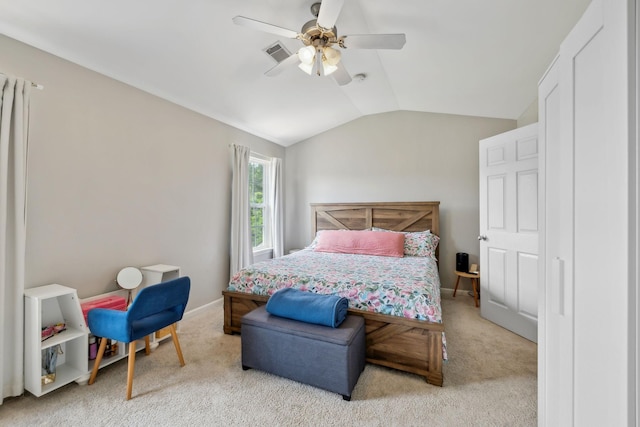 bedroom featuring visible vents, ceiling fan, lofted ceiling, and light colored carpet