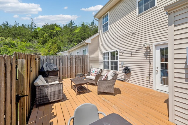 deck featuring fence and an outdoor hangout area