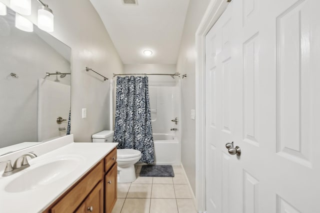 full bathroom featuring tile patterned floors, shower / bath combo, vanity, and toilet