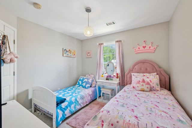 bedroom featuring carpet floors and visible vents