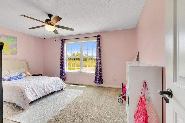 bedroom featuring baseboards, carpet, and a ceiling fan