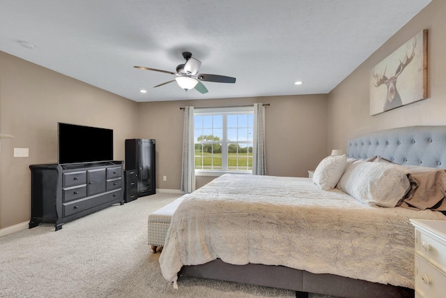 bedroom with baseboards, recessed lighting, ceiling fan, and light colored carpet