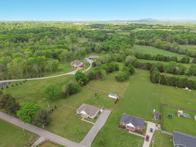 birds eye view of property with a rural view