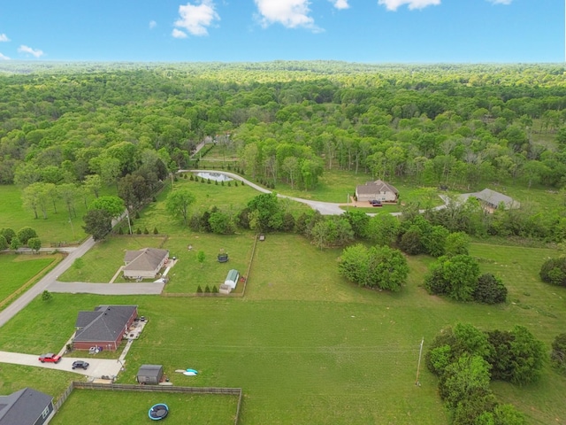 bird's eye view featuring a forest view