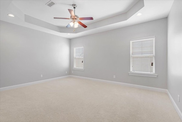 unfurnished room featuring recessed lighting, baseboards, visible vents, and light carpet