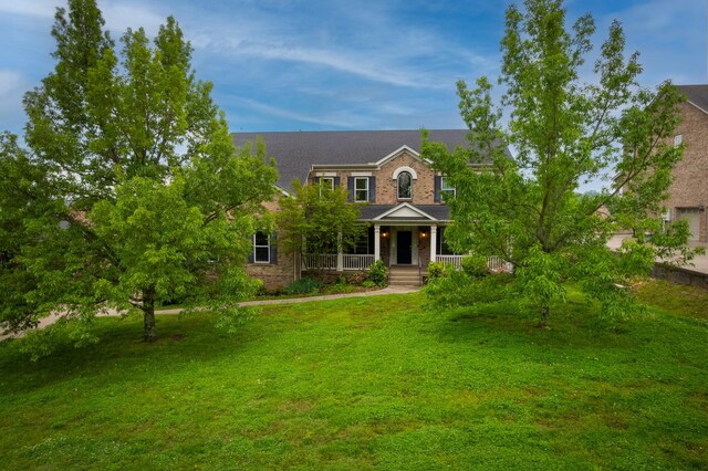 9657 Brass Valley Dr, Brentwood, TN 37027 - view of front of home featuring a porch, a front lawn, and brick siding