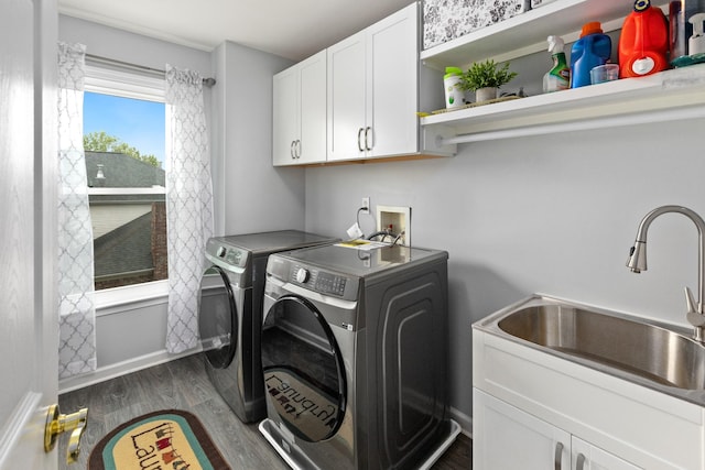 9657 Brass Valley Dr, Brentwood, TN 37027 - laundry area with washing machine and clothes dryer, cabinet space, a sink, baseboards, and dark wood-style floors