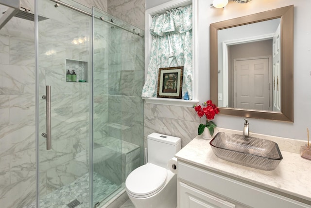 9657 Brass Valley Dr, Brentwood, TN 37027 - full bath with toilet, tile walls, a marble finish shower, and vanity