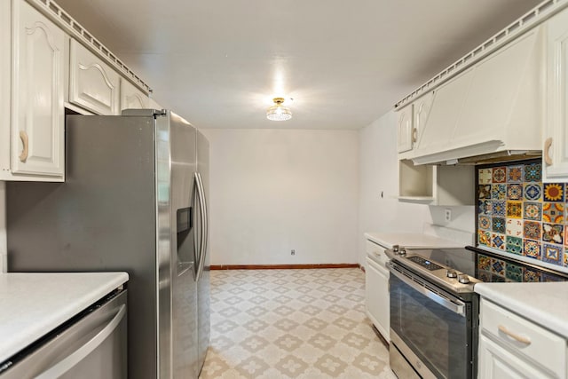 702 1st Ave, Mount Pleasant, TN 38474 - kitchen featuring appliances with stainless steel finishes, light countertops, baseboards, premium range hood, and light floors
