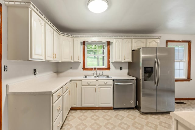 702 1st Ave, Mount Pleasant, TN 38474 - kitchen with a sink, light floors, appliances with stainless steel finishes, and light countertops