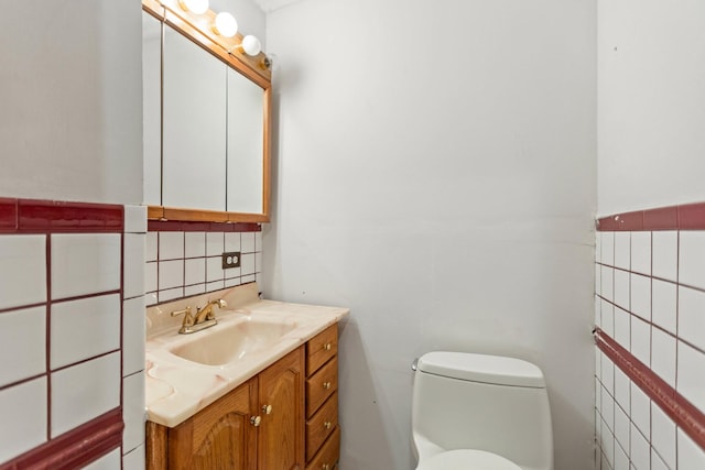 702 1st Ave, Mount Pleasant, TN 38474 - bathroom with vanity, tasteful backsplash, toilet, and tile walls