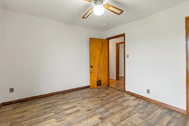 702 1st Ave, Mount Pleasant, TN 38474 - spare room featuring a ceiling fan, baseboards, and wood finished floors