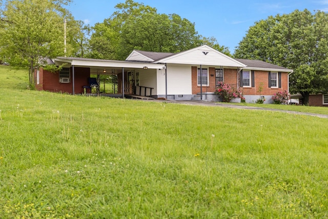 702 1st Ave, Mount Pleasant, TN 38474 - view of front of home featuring brick siding, a front lawn, and a carport