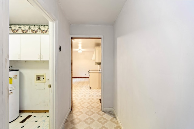 702 1st Ave, Mount Pleasant, TN 38474 - hallway featuring water heater, light floors, and baseboards
