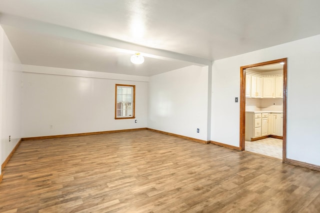 702 1st Ave, Mount Pleasant, TN 38474 - unfurnished room with baseboards and light wood-style flooring