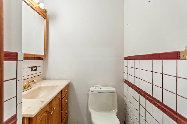 702 1st Ave, Mount Pleasant, TN 38474 - bathroom featuring backsplash, toilet, tile walls, and vanity