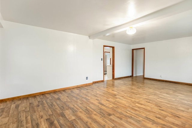 702 1st Ave, Mount Pleasant, TN 38474 - spare room featuring light wood-style floors and baseboards