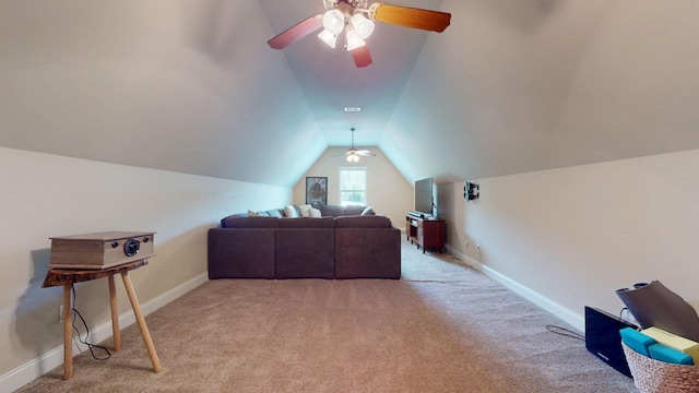 interior space with light colored carpet, baseboards, ceiling fan, and lofted ceiling