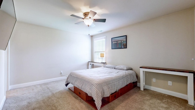 carpeted bedroom with baseboards, visible vents, and ceiling fan