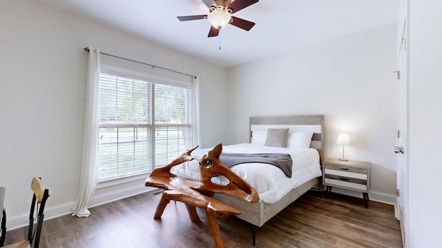 bedroom with baseboards, a ceiling fan, and wood finished floors