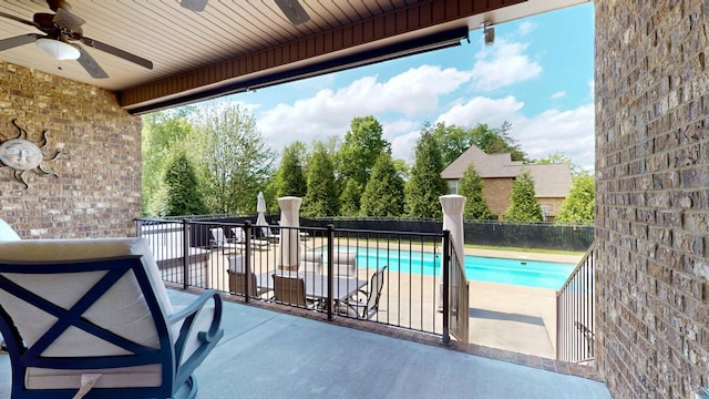 view of pool featuring fence, ceiling fan, a fenced in pool, and a patio area
