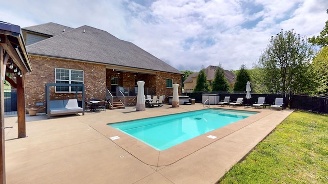 view of swimming pool featuring fence, a patio area, and a fenced in pool